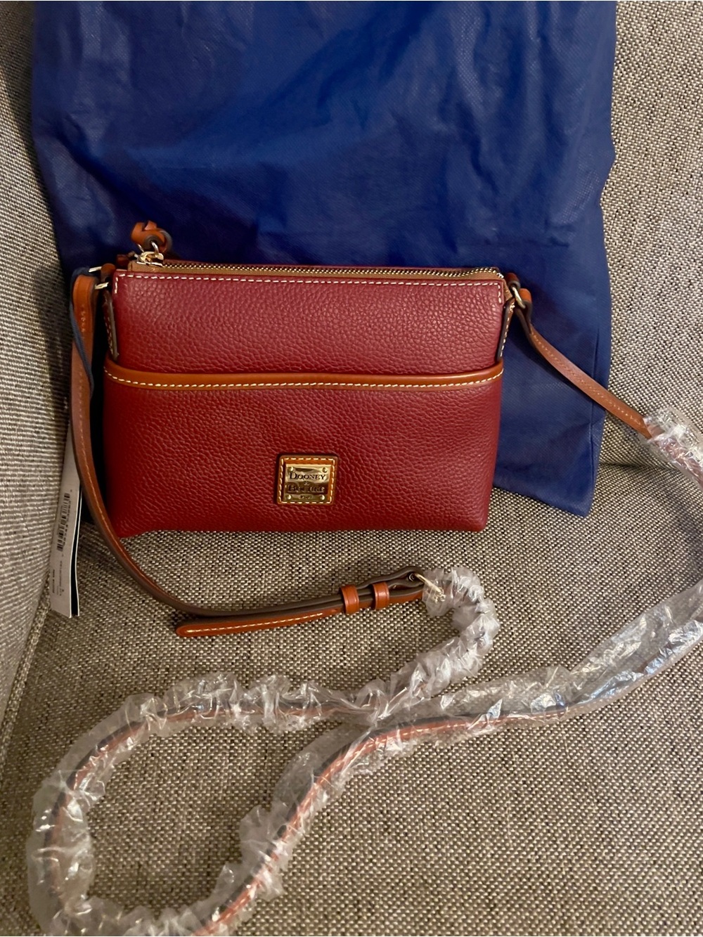 Dooney & Bourke Pebble Grain Ginger Pouchette -Wine